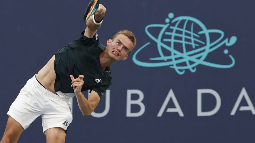 Luca Van Assche hitting a serve