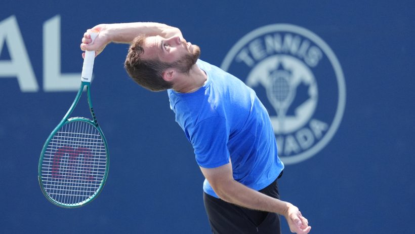 Hugo Gaston hitting a serve