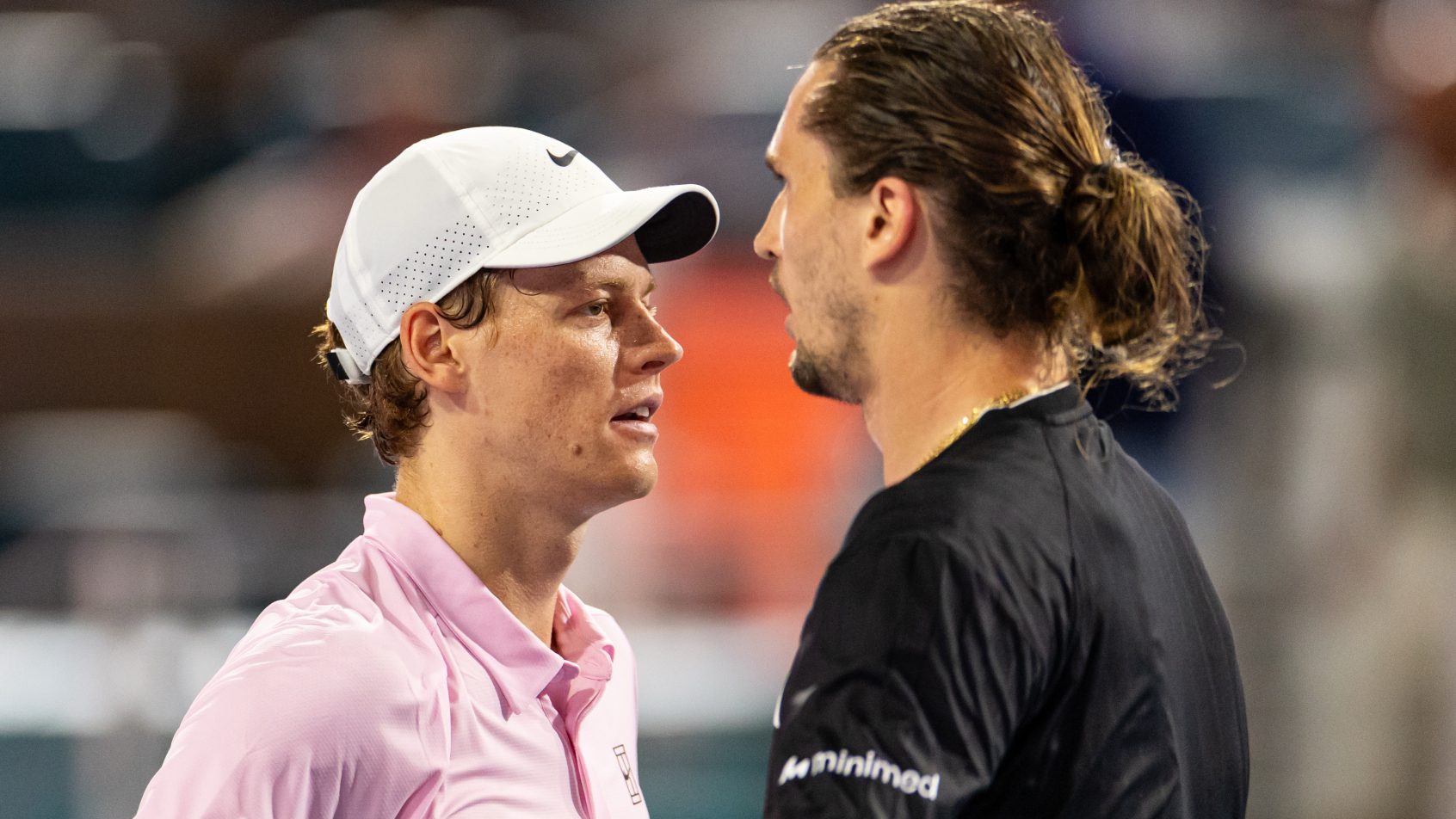 Jannik Sinner of Italy is congratulated by Alexander Zverev of Germany