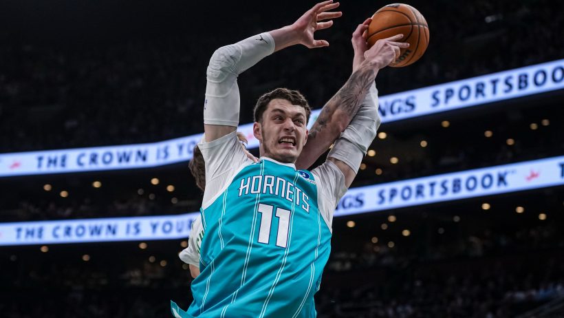 Ryan Kalkbrenner battles for a rebound against the Celtics.