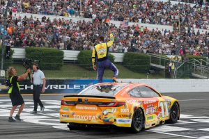 Denny Hamlin celebrates in Pocono (2026).