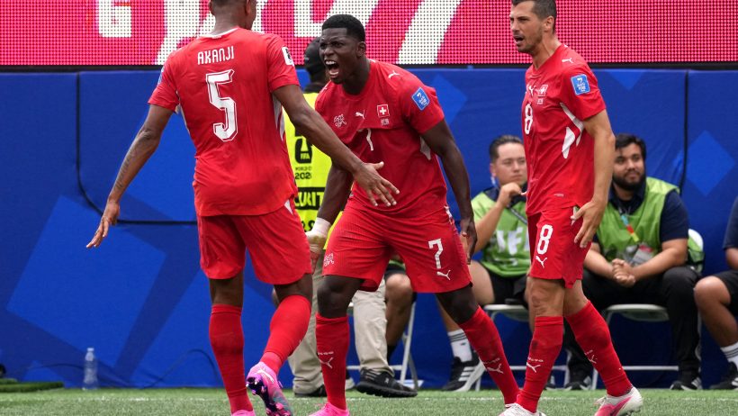 Manuel Akanji, Breel Embolo and Remo Freuler celebrating a goal