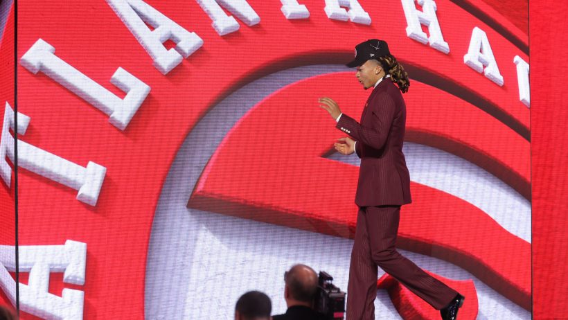 Kingston Flemings walks across the stage after being drafted by the Hawks.