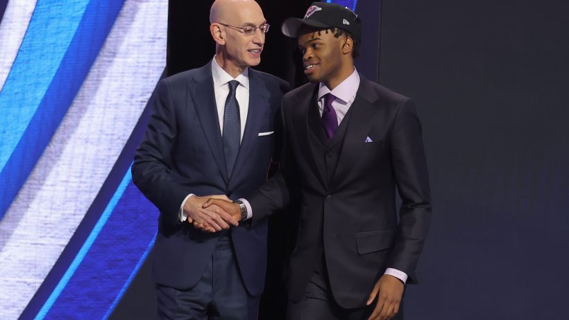 Ebuka Okorie shakes hands with commissioner draft night