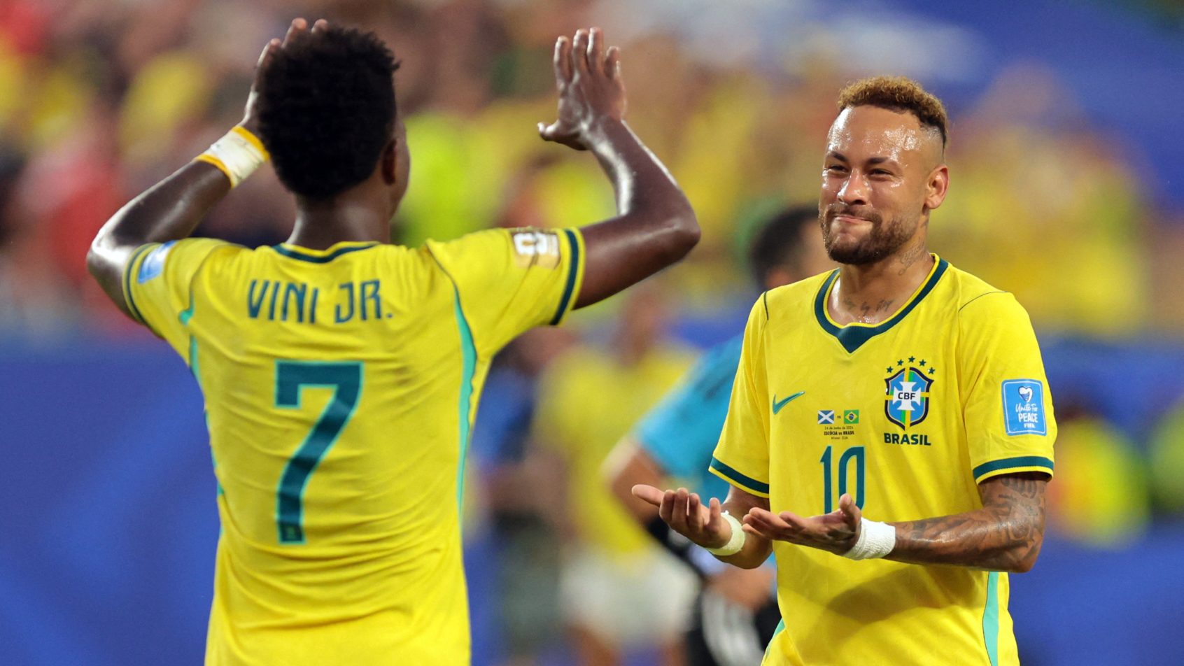Brazil's Neymar Jr. celebrates after the match with Vinicius Junior