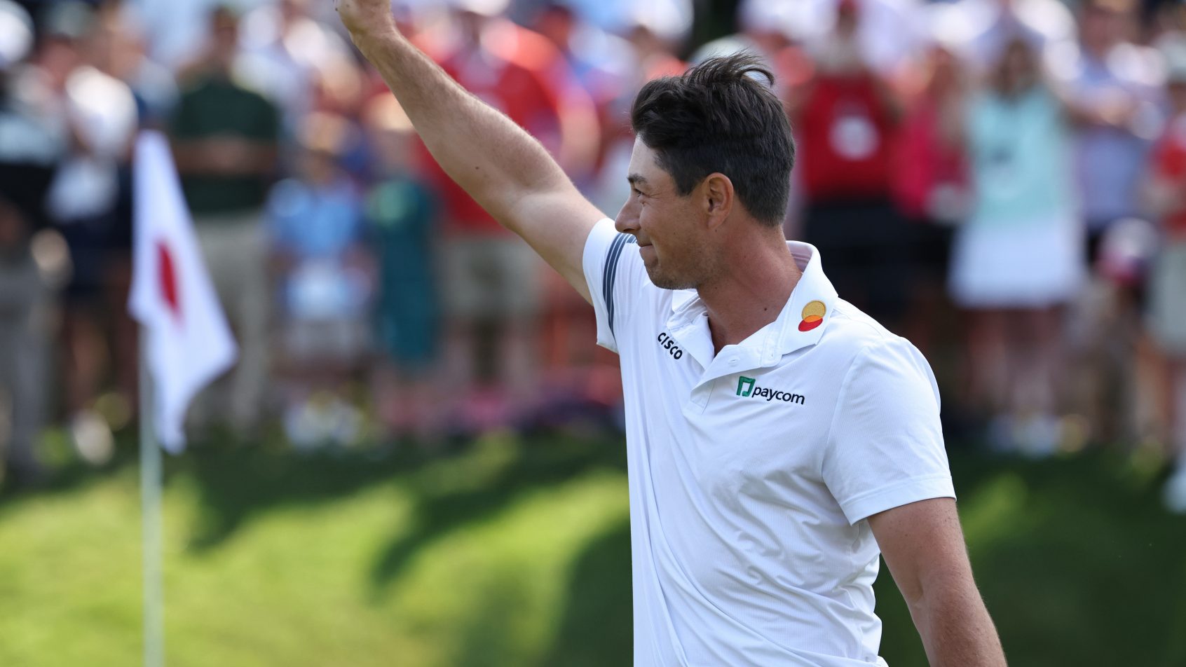 Viktor Hovland celebrates after winning the Travelers Championship.