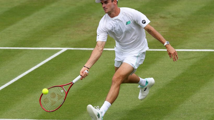 Tommy Paul stretches for a forehand
