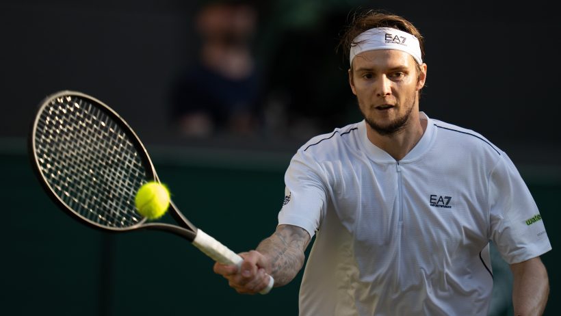 Alexander Bublik hitting a forehand slice