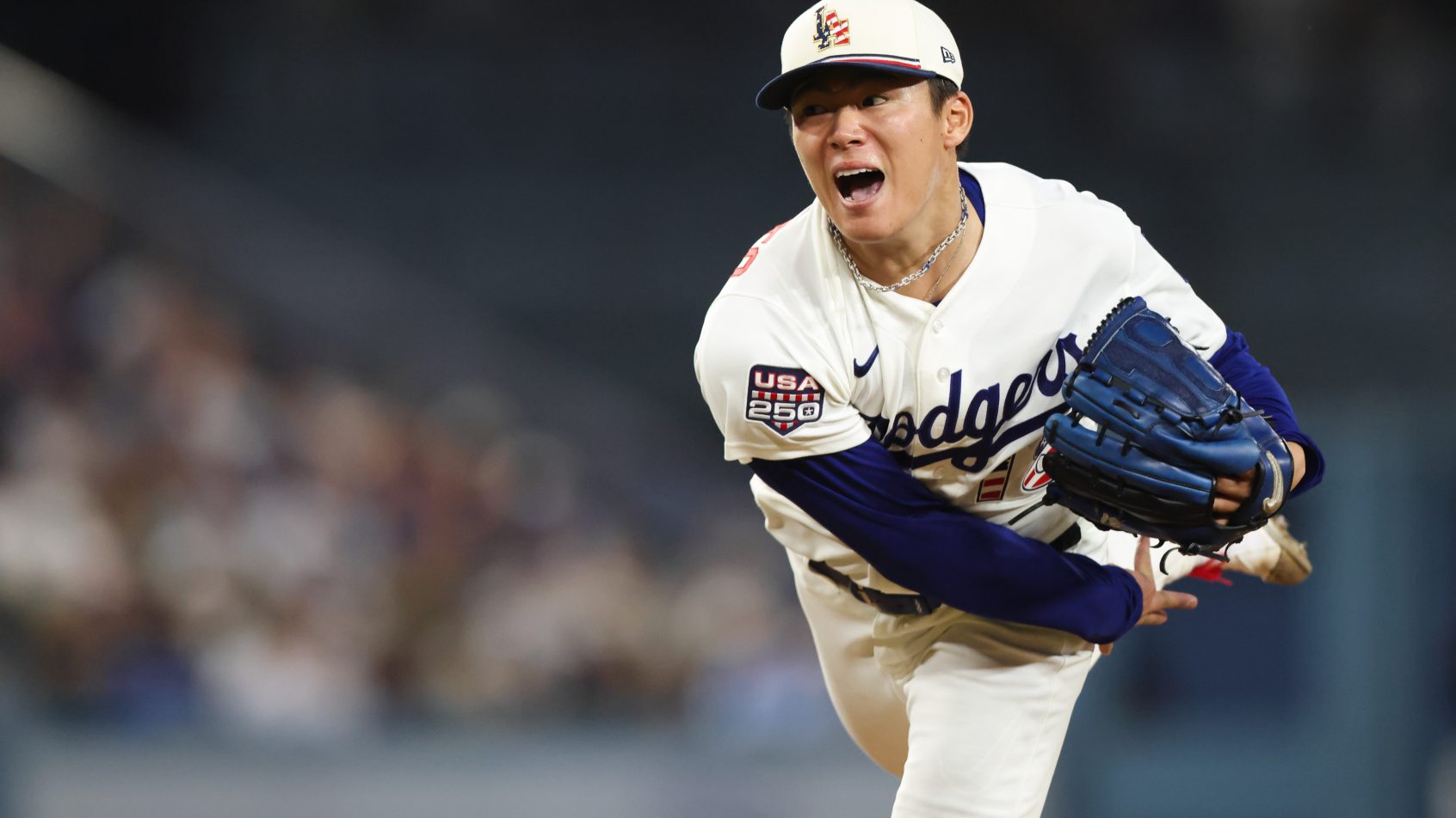 Yoshinobu Yamamoto delivers a pitch against the San Diego Padres.