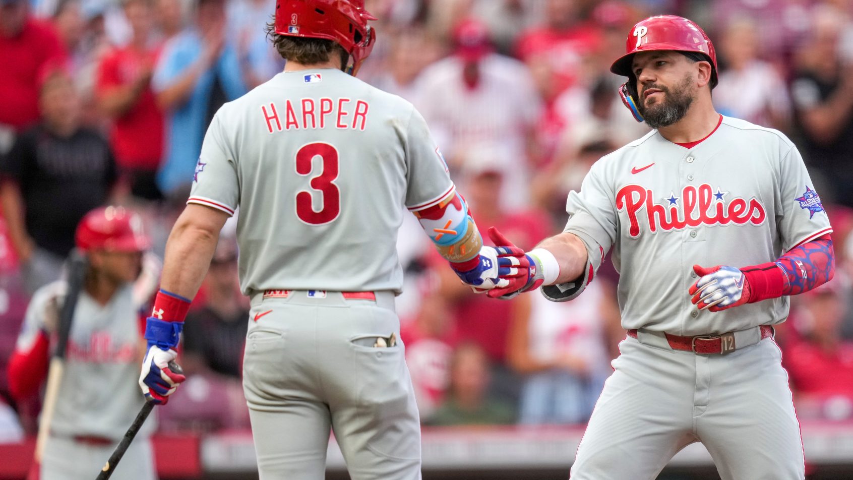 Kyle Schwarber and Bryce Harper celebrate a Phillies home run.