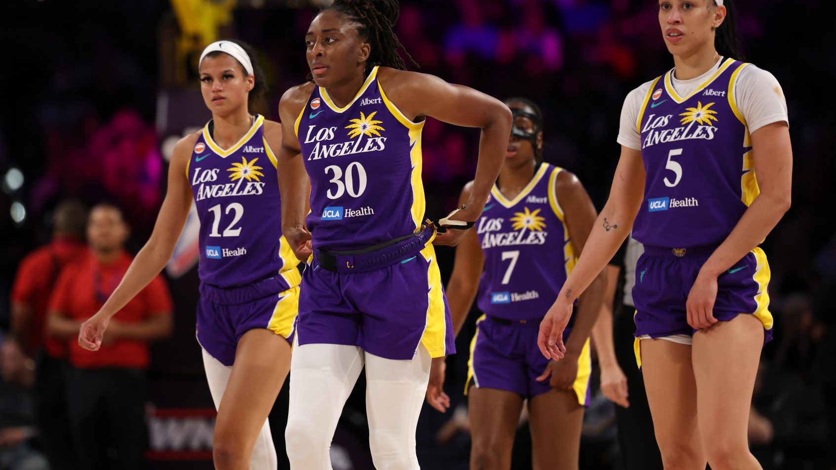 LA Sparks team walking to center court