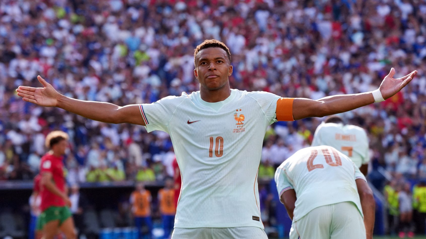 Kylian Mbappe celebrates scoring a goal versus Morocco.