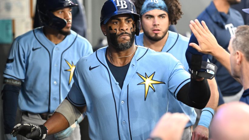 Yandy Diaz celebrates in the Rays dugout vs the Blue Jays.