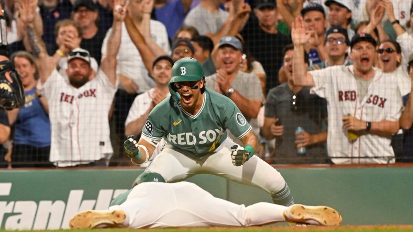The Red Sox celebrate a run versus the Blue Jays.