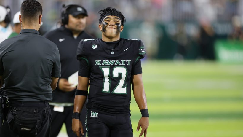 Micah Alejado walking sideline