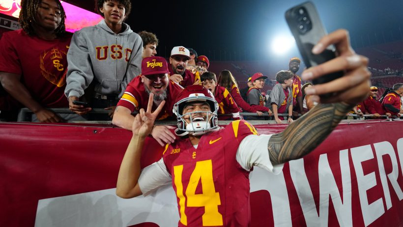 Jayden Maiava poses for a selfie after a USC victory.