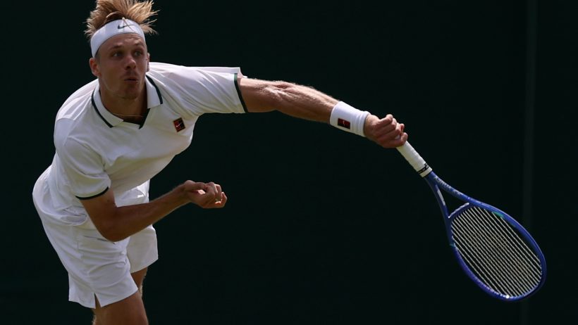Denis Shapovalov hitting a serve