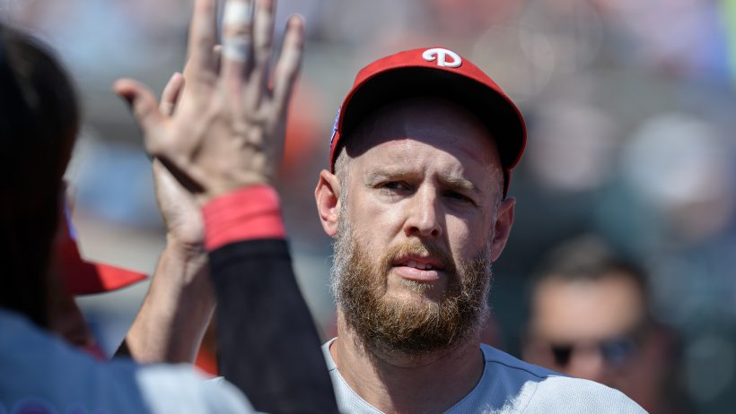 Zack Wheeler high-fives his teammates after a Phillies win.