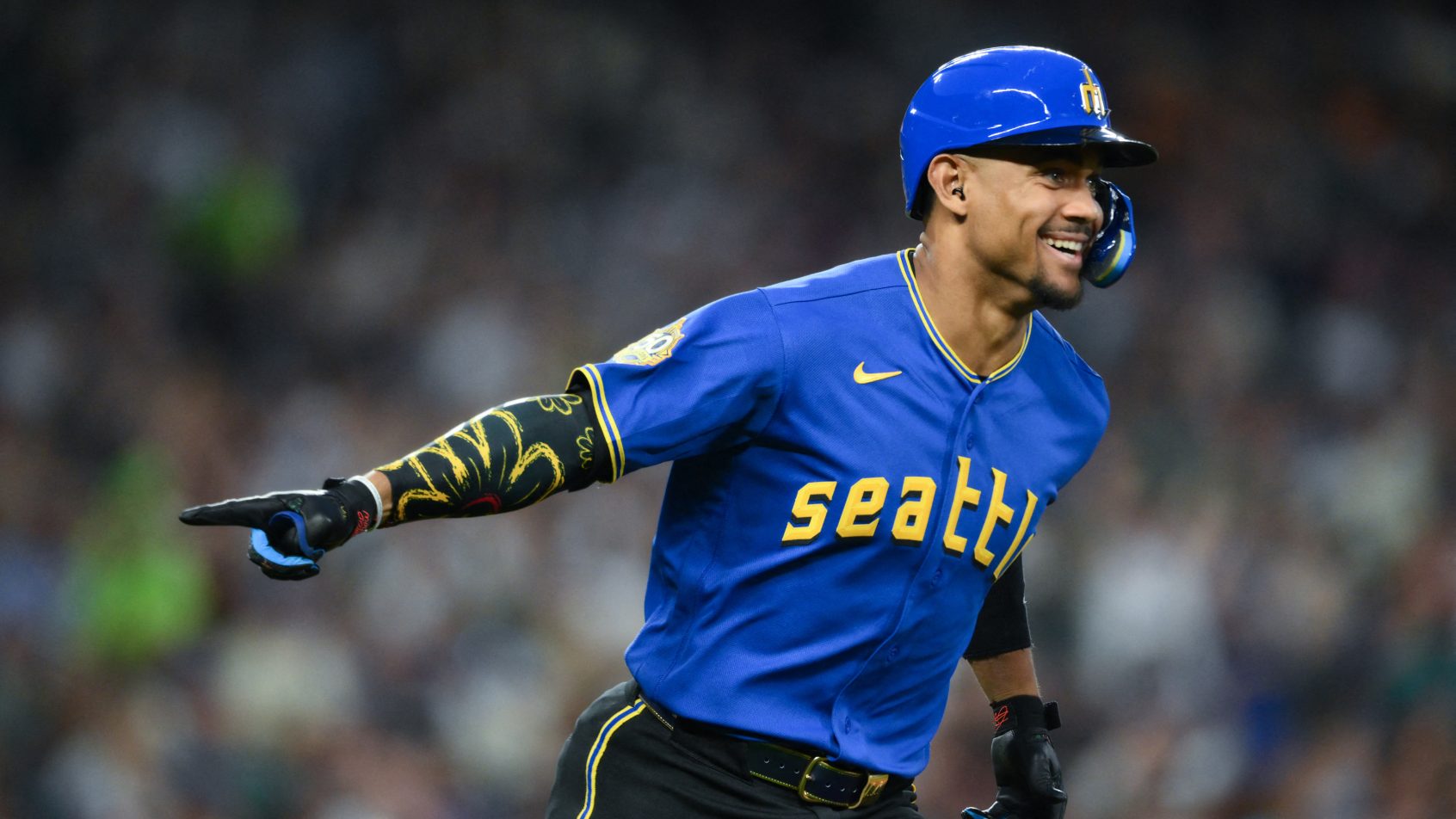 Julio Rodriguez celebrates a home run versus the Twins.
