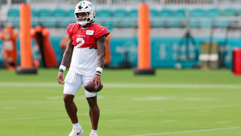 Malik Willis holding football in practice