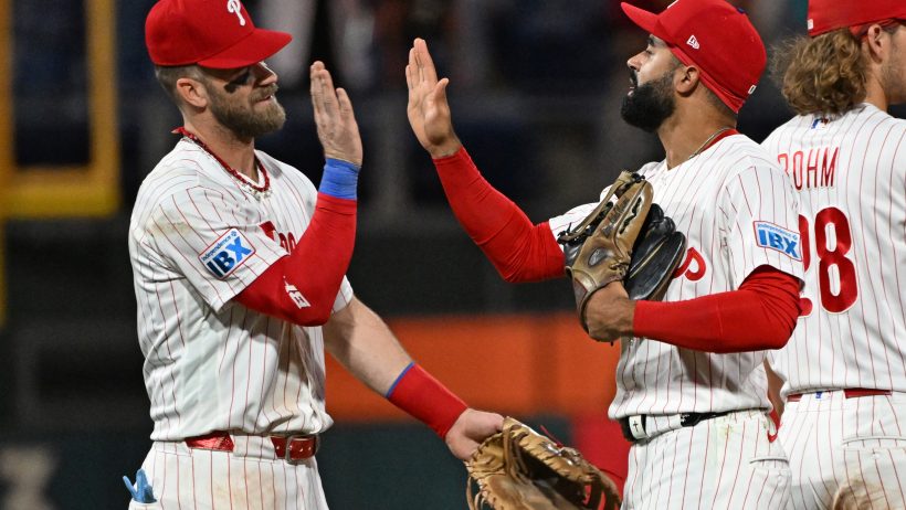 Bryce Harper celebrates a win with teammates.