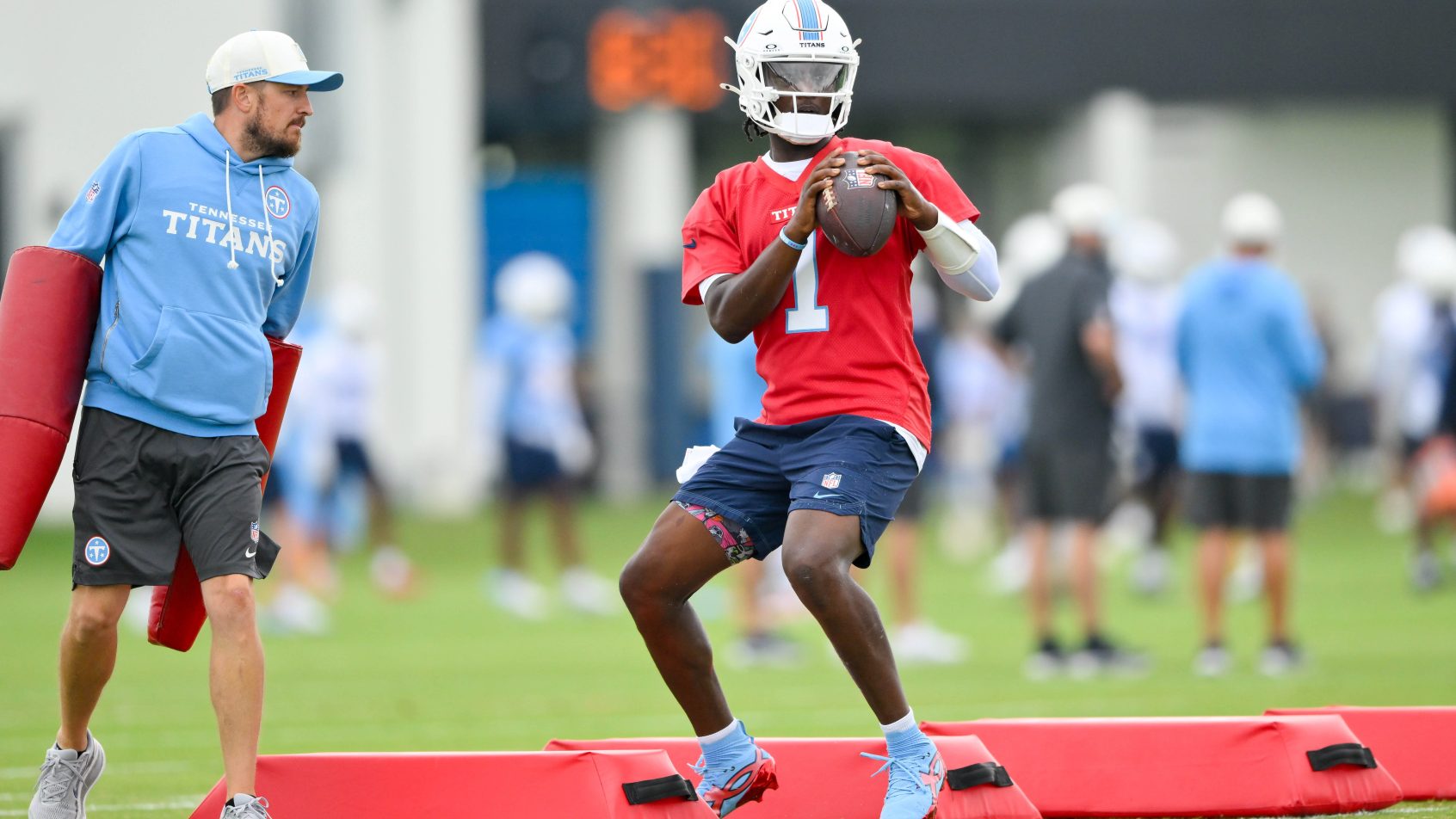 Cam Ward throwing a pass during training camp with the Tennessee Titans in the 2026 NFL preseason.