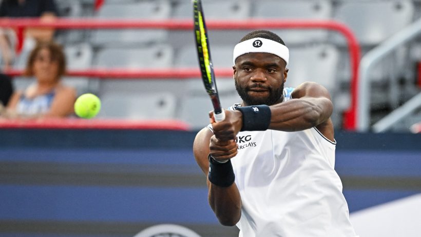 Frances Tiafoe hitting a backhand