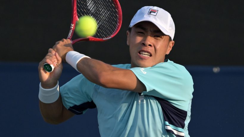 Brandon Nakashima hitting a backhand