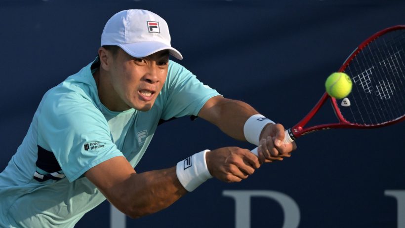 Brandon Nakashima hitting a backhand
