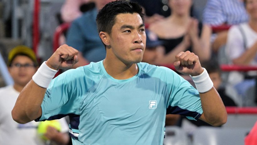 Brandon Nakashima arms up celebration