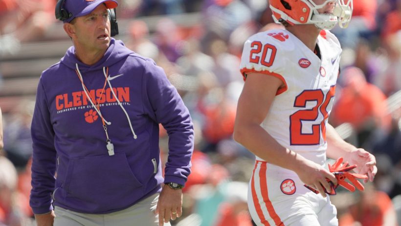 Clemson head coach Dabo Swinney pictured next to receiver Clark Sanderson
