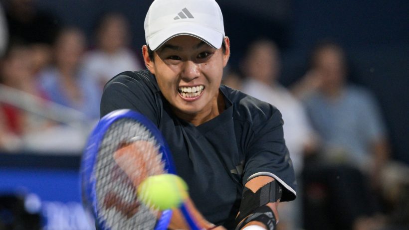 Learner Tien smacks a two-handed backhand at the National Bank Open.