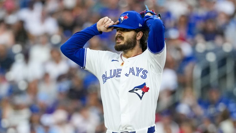 Dylan Cease adjusts hat
