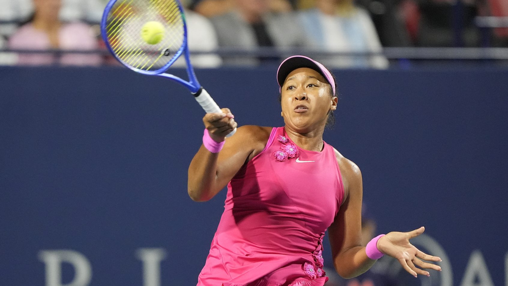 Naomi Osaka hitting a forehand