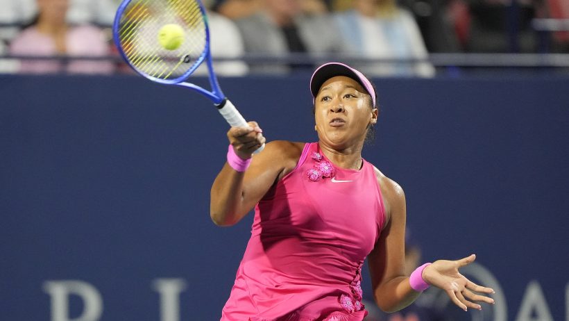 Naomi Osaka hitting a forehand