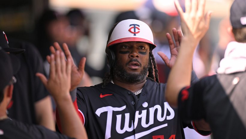 Josh Bell celebrates in the Twins dugout.