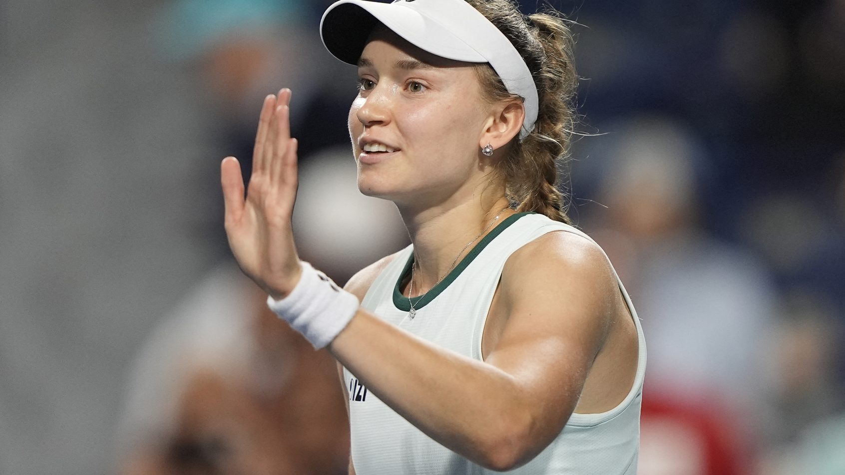 Elena Rybakina waving left hand