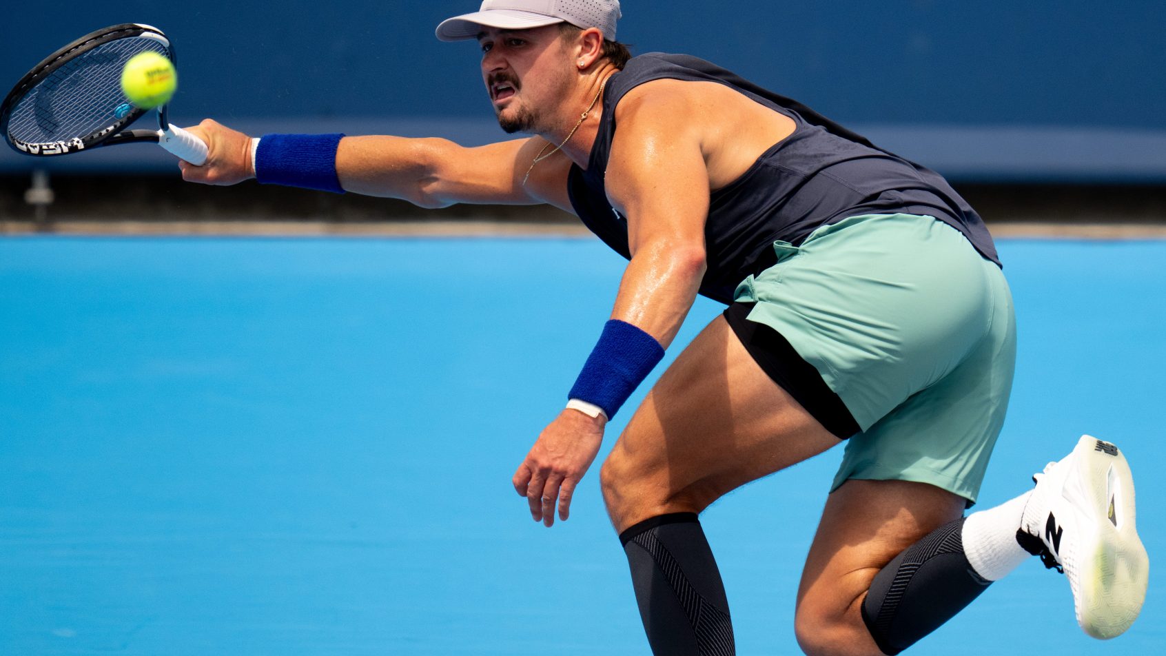 JJ Wolf hitting a forehand