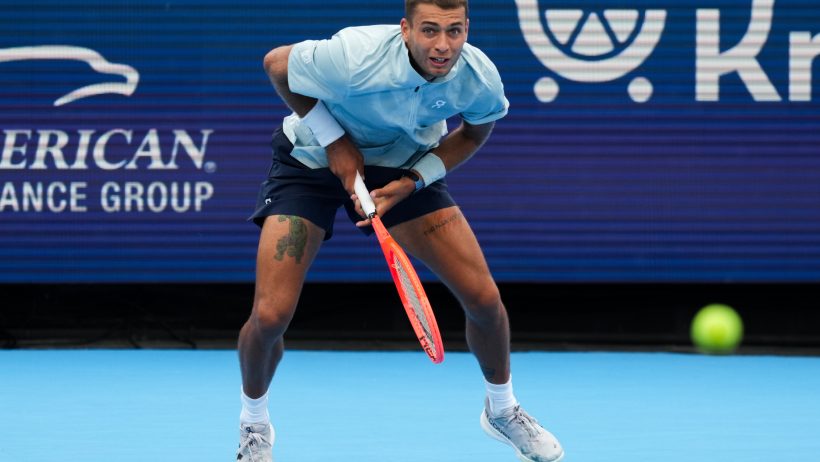 Flavio Cobolli returns serve