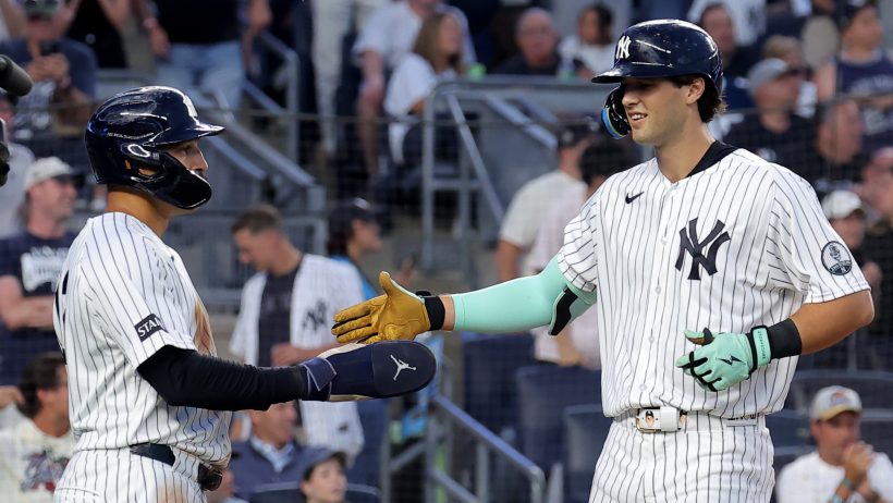 The Yankees celebrate a home run vs the Blue Jays.