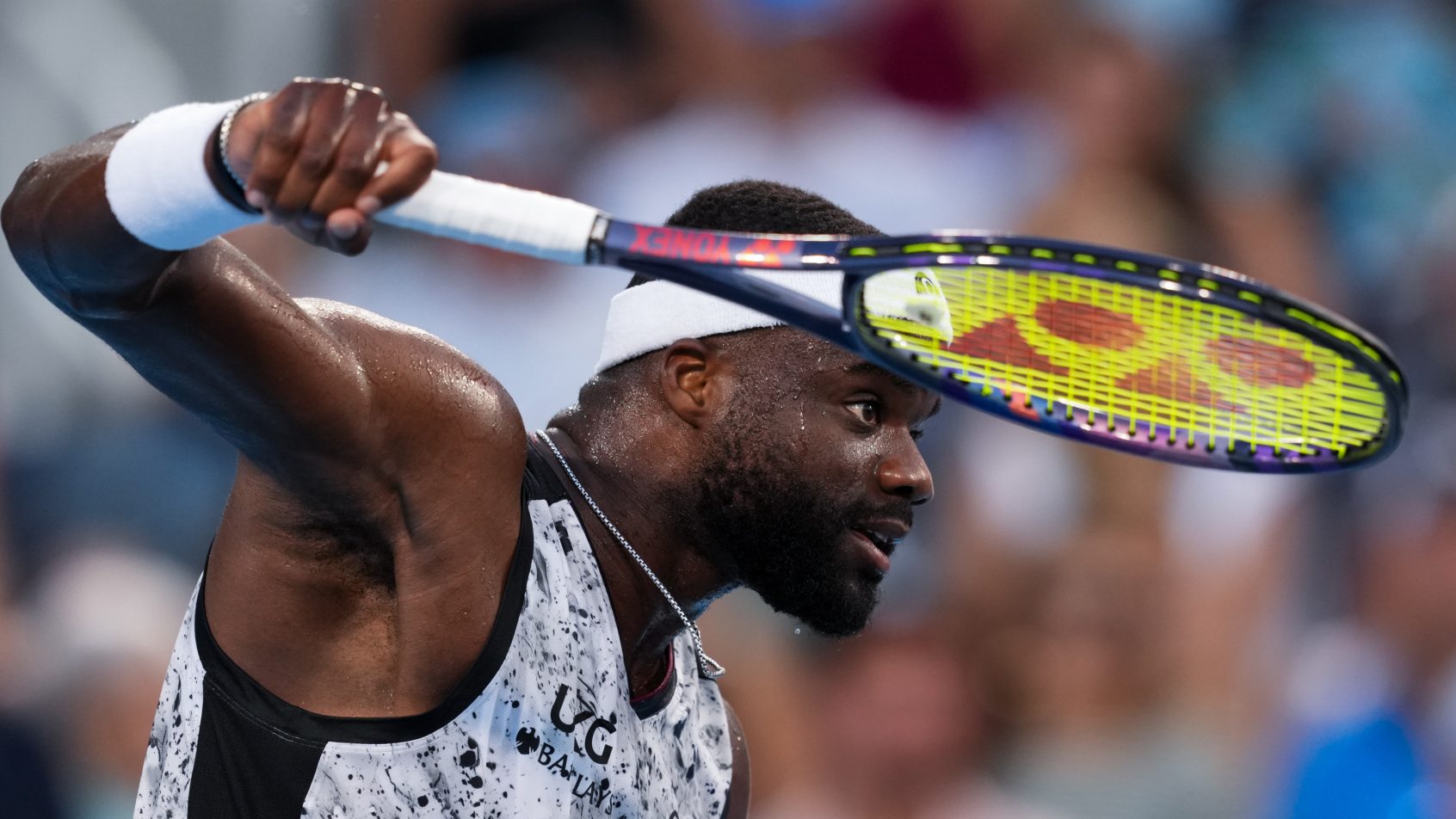 Frances Tiafoe returns during a match at the Cincinnati Open.