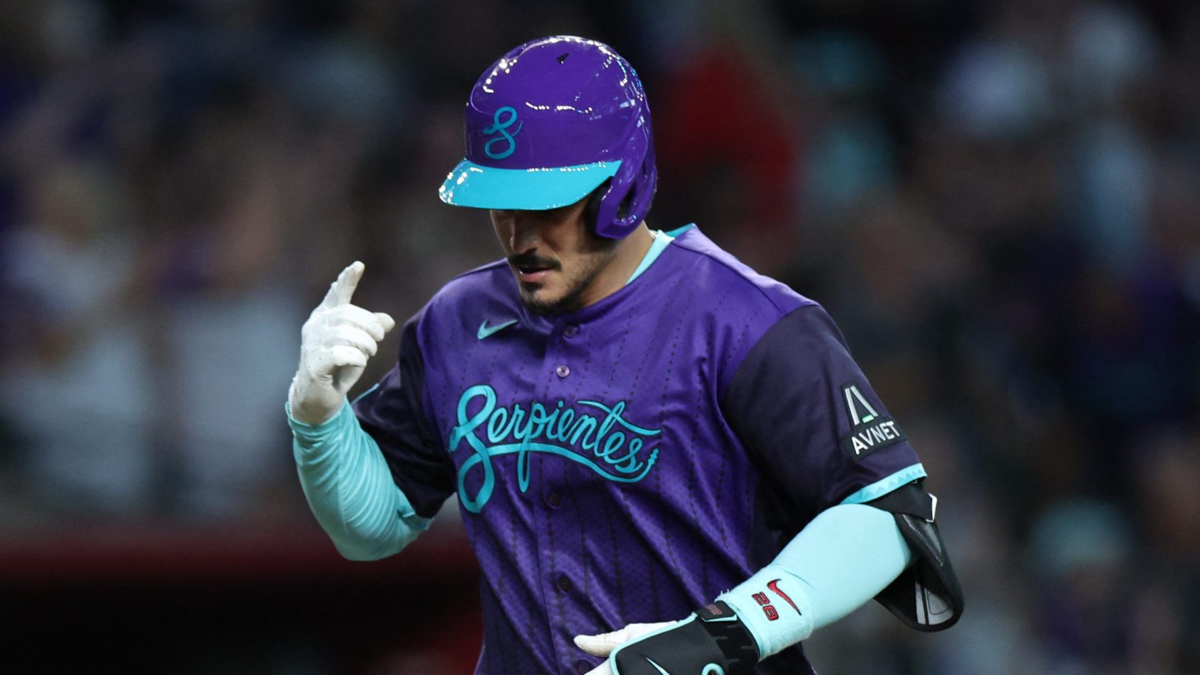 Nolan Arenado celebrates a home run vs the Reds.