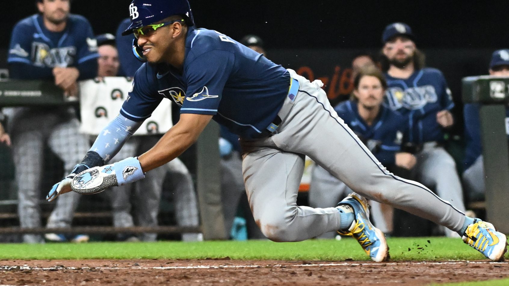 Richie Palacios slides head first at home plate versus the Orioles.