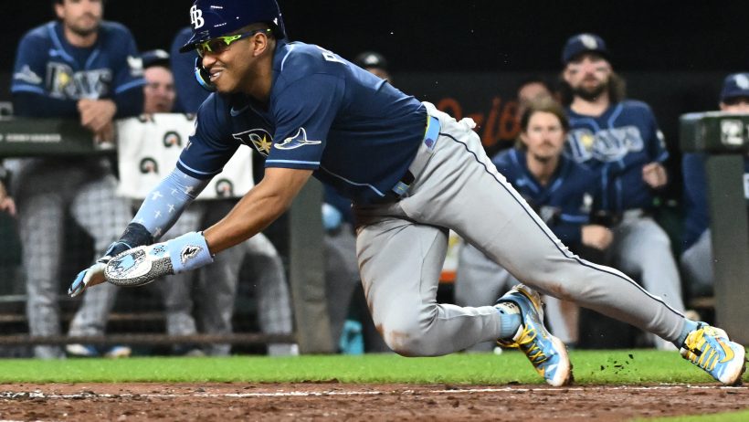 Richie Palacios slides head first at home plate versus the Orioles.