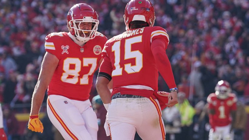 Travis Kelce celebrates with Patrick Mahomes