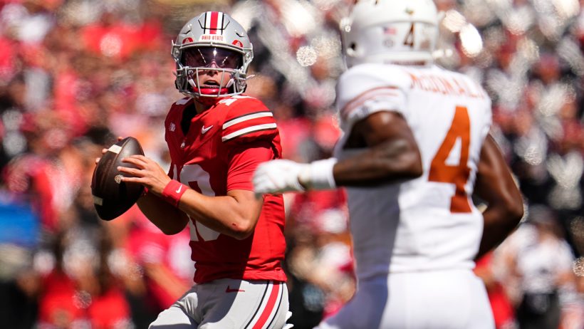 Ohio State Buckeyes quarterback Julian Sayin looks to pass over Texas Longhorns defensive back Jelani McDonald