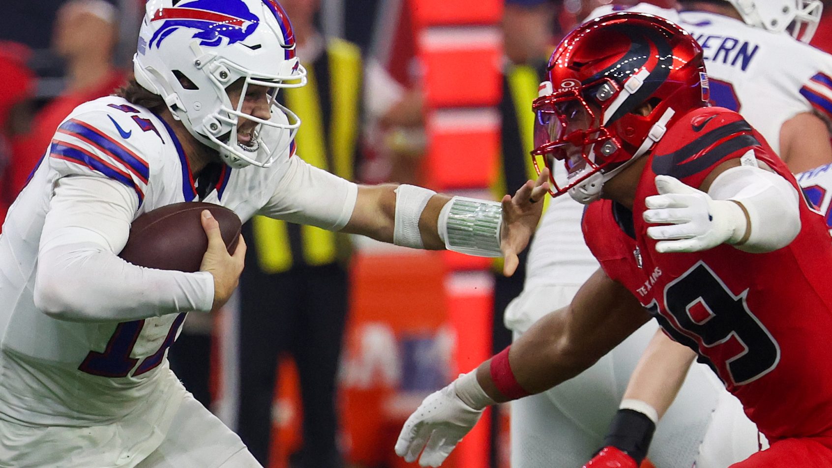 Buffalo Bills quarterback Josh Allen carrying the ball