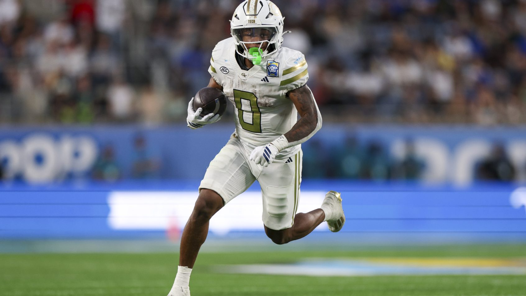 Malachi Hosley running with football