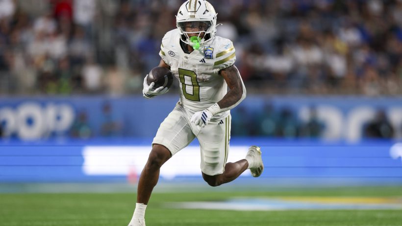 Malachi Hosley running with football