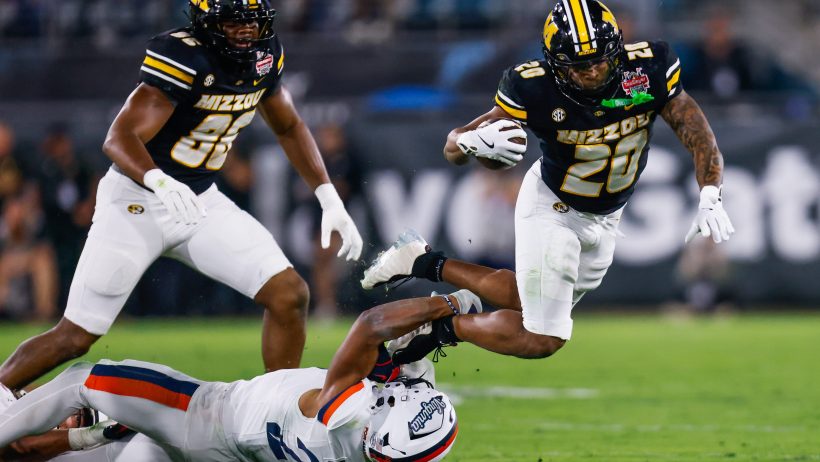 Jamal Roberts rushes for the Tigers.